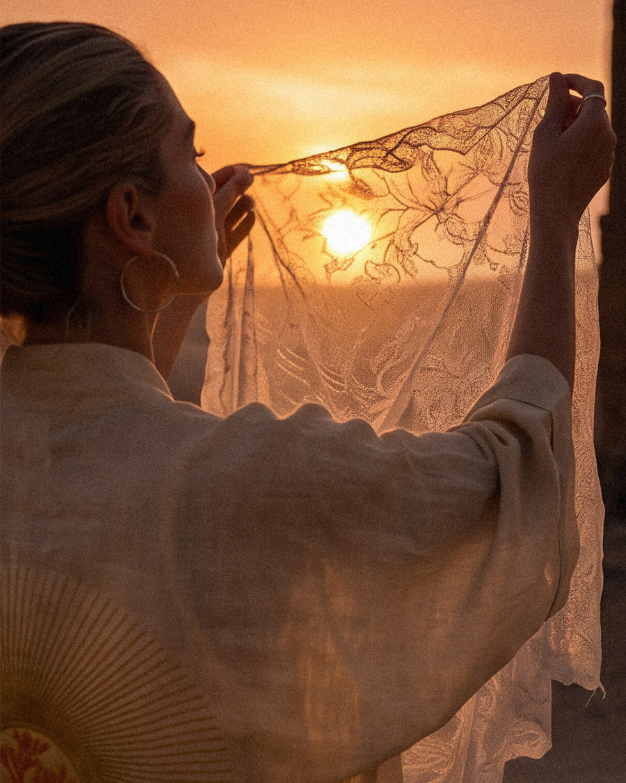 LVX kimono silhouette with lace veil at sunset